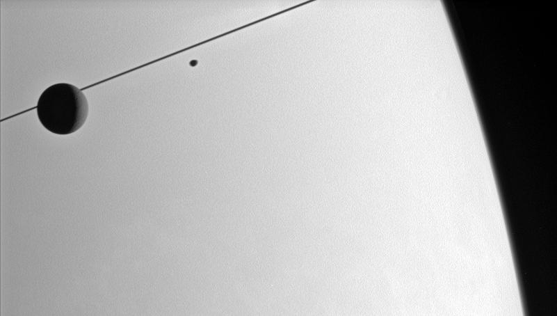 Dione and Janus, with Saturn in the background