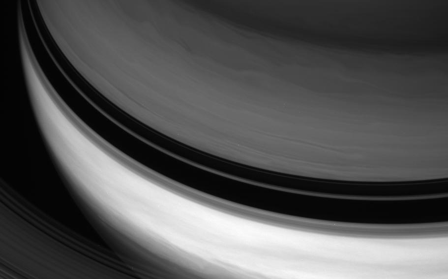 Shadows cast by Saturn's rings separate the planet's bright equatorial band from the darker northern latitudes.