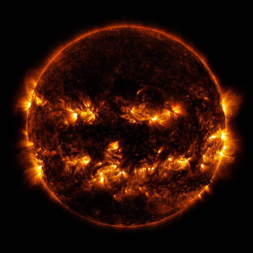Active regions on the Sun give it the appearance of a jack-o'-lantern. This image is a blend of 171 and 193 angstrom light as captured by the Solar Dynamics Observatory.