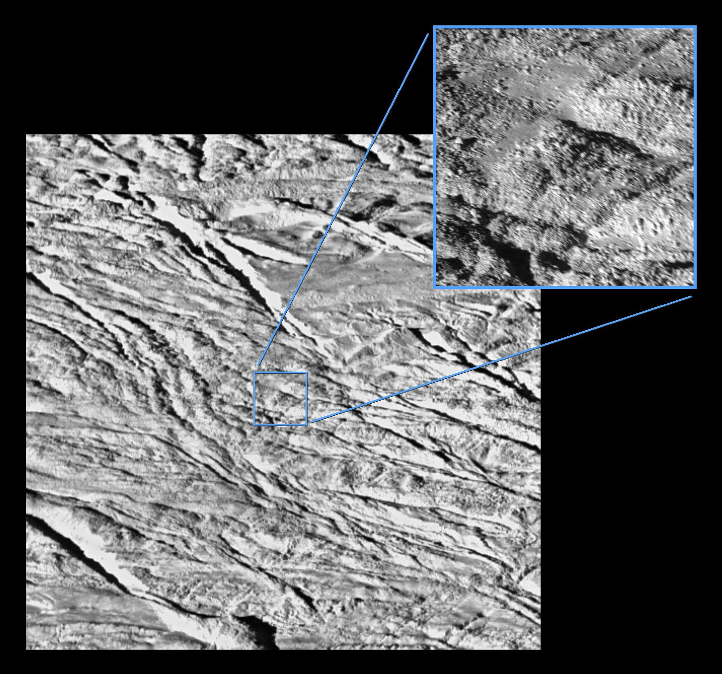 Two views of Enceladus: one, larger view is of lower resolution; the smaller inset view is of higher resolution