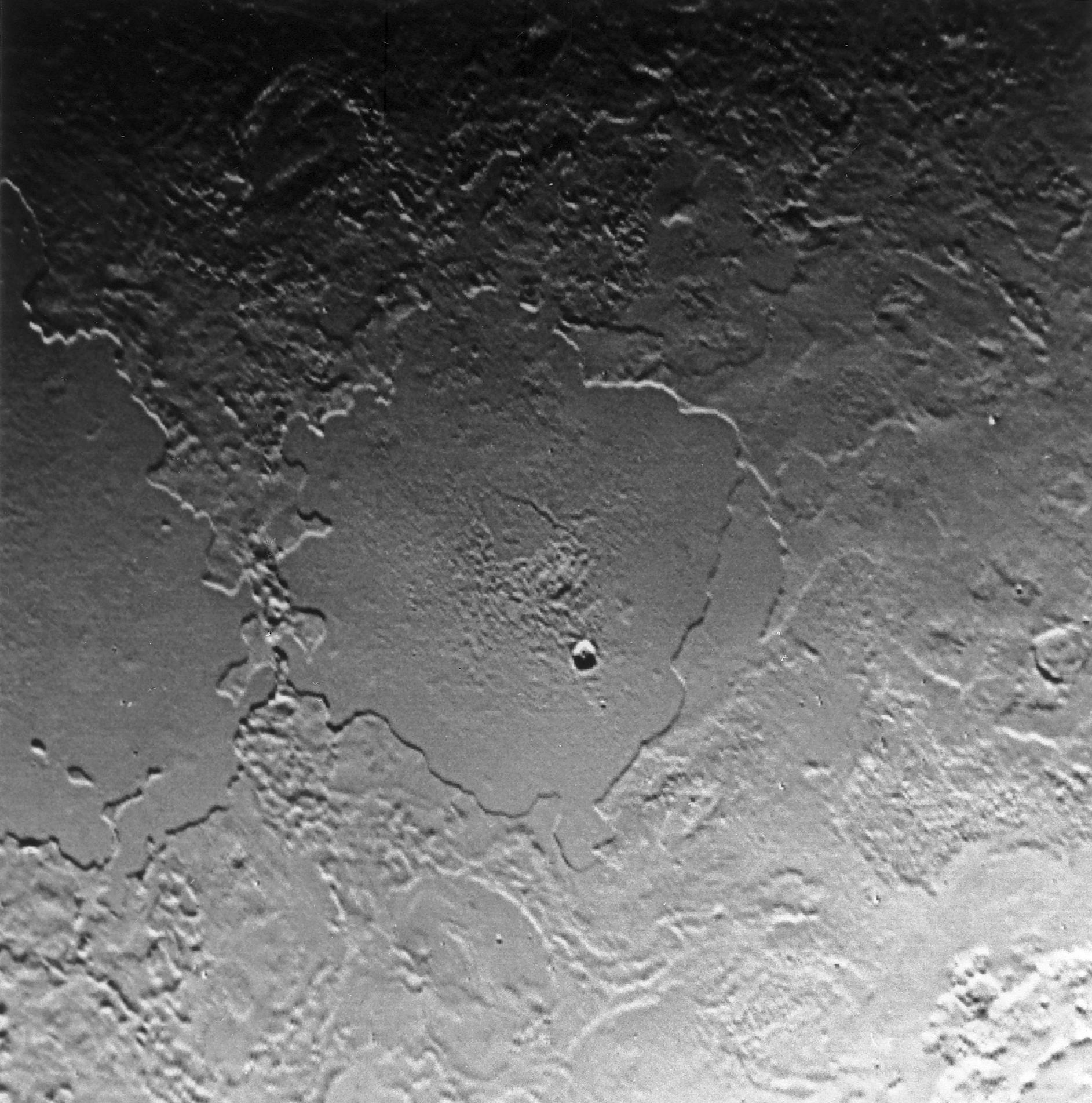 Part of the complex geologic history of icy Triton, Neptune's largest satellite, is shown in this Voyager 2 photo, which has a resolution of 900 meters (2,700 feet) per picture element.