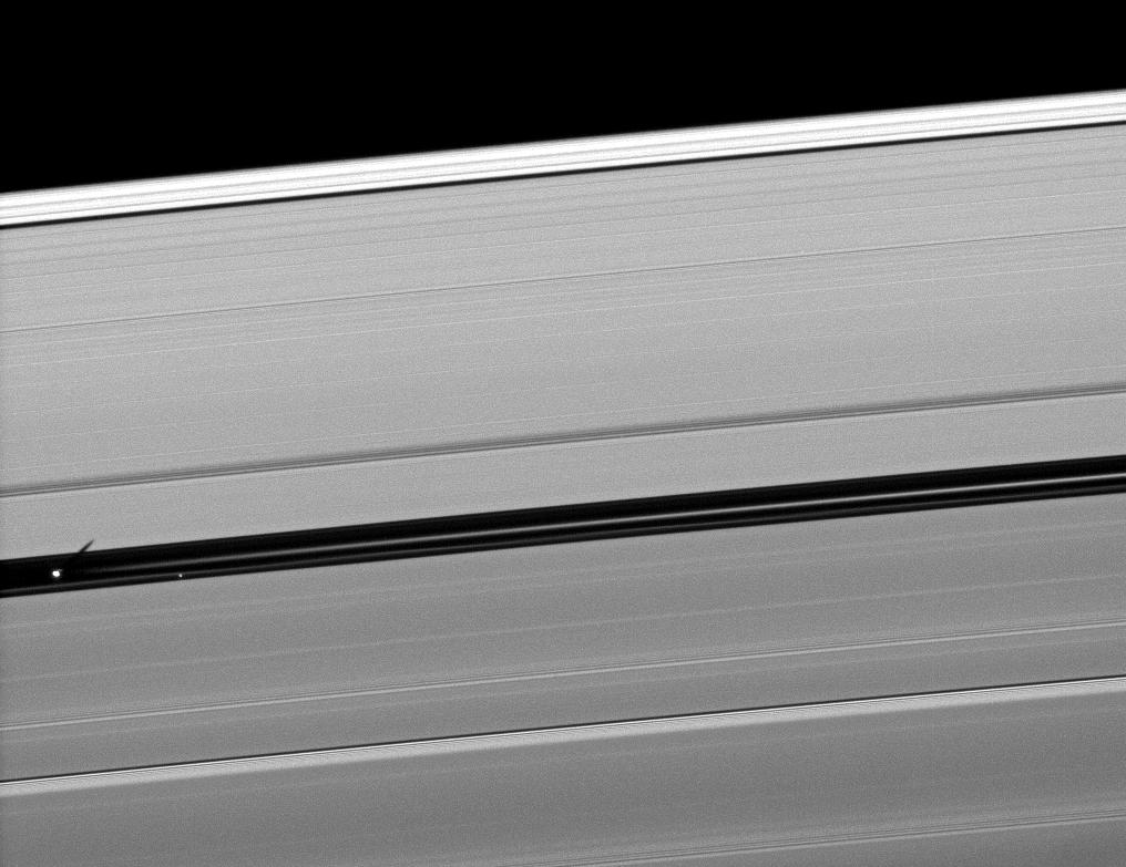 Orbiting in the Encke Gap of Saturn's A ring, the moon Pan casts a shadow on the ring in this image taken about six months after the planet's August 2009 equinox.