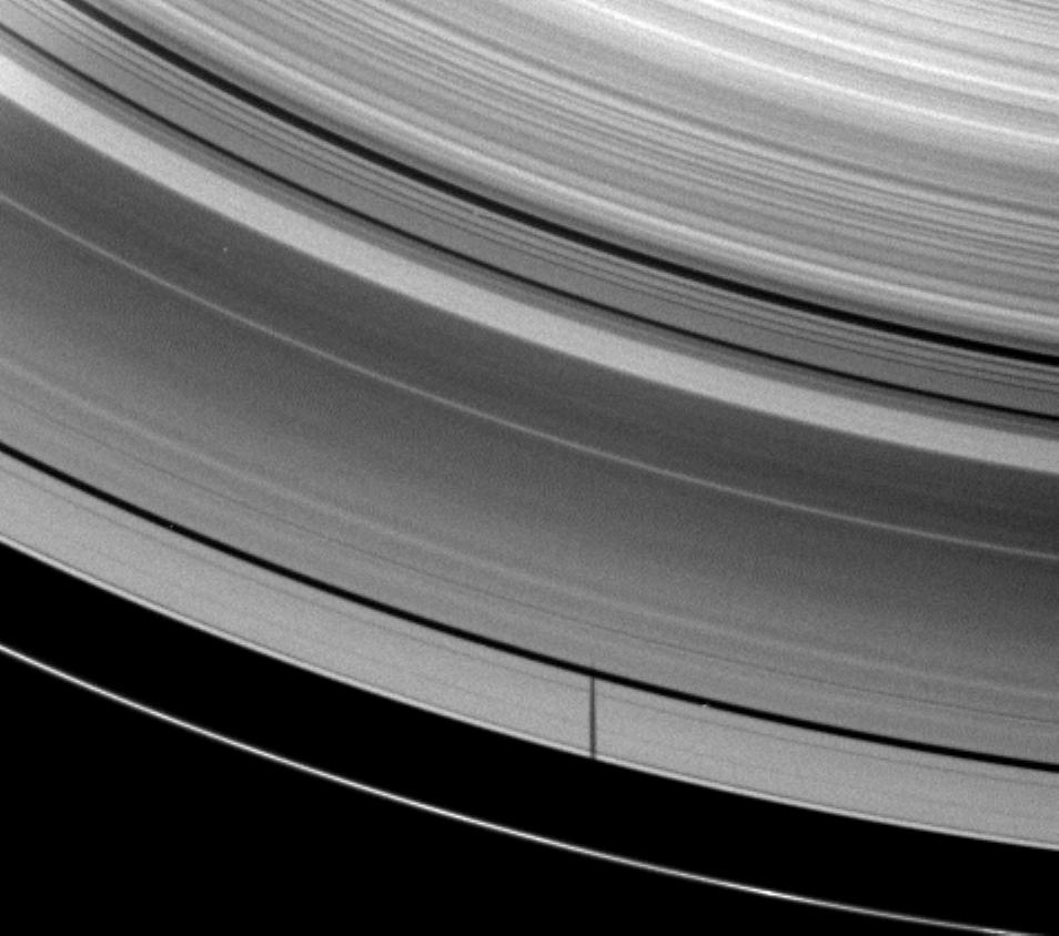 The moon Janus casts a shadow on Saturn's A ring but misses the thin F ring