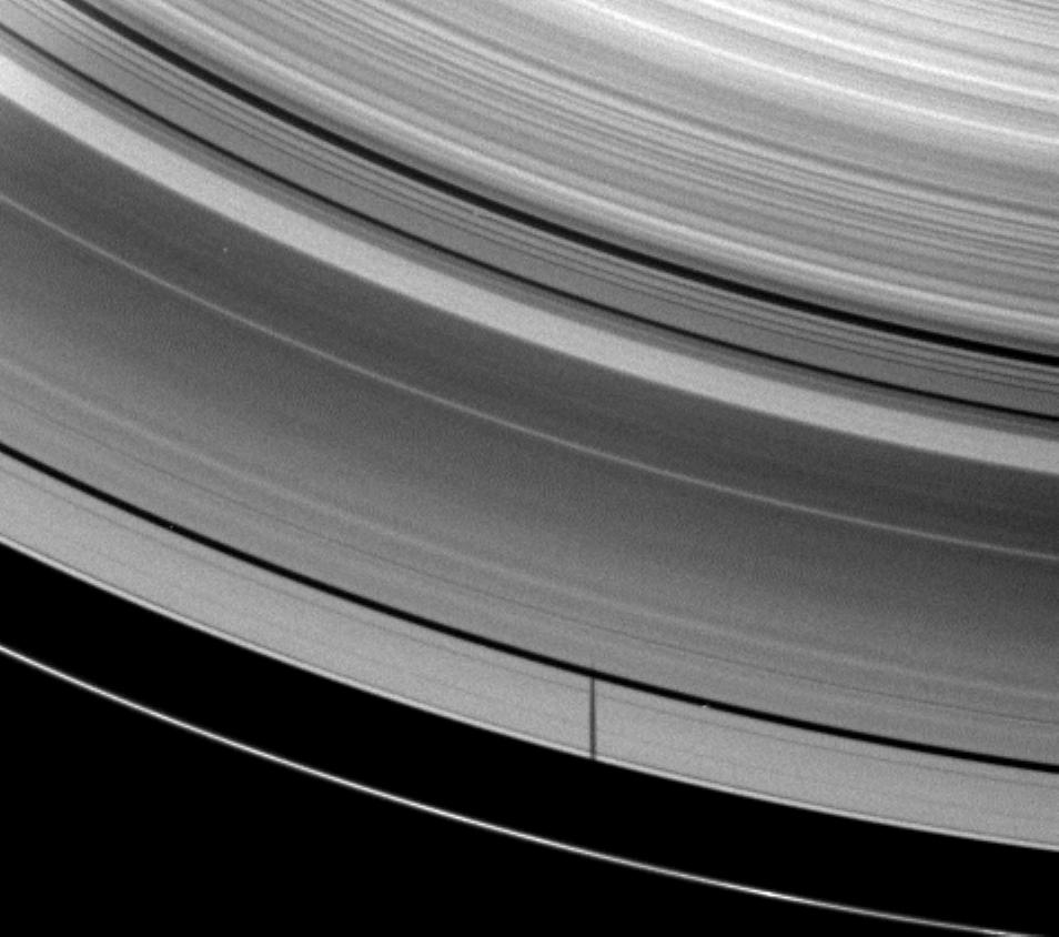 The moon Janus casts a shadow on Saturn's A ring but misses the thin F ring