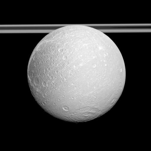 The Cassini spacecraft examines the anti-Saturnian side of Dione and shows the cratered surface east of the moon's distinctive wispy terrain.