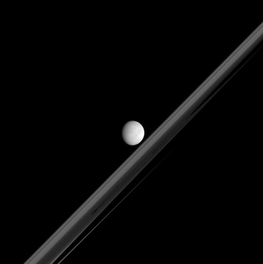 Enceladus in front of Saturn's Ring