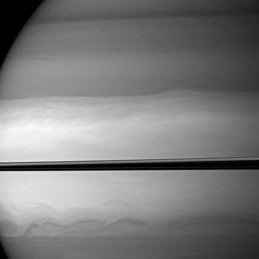 The Cassini spacecraft watches as clouds swirl through Saturn's equatorial latitudes.