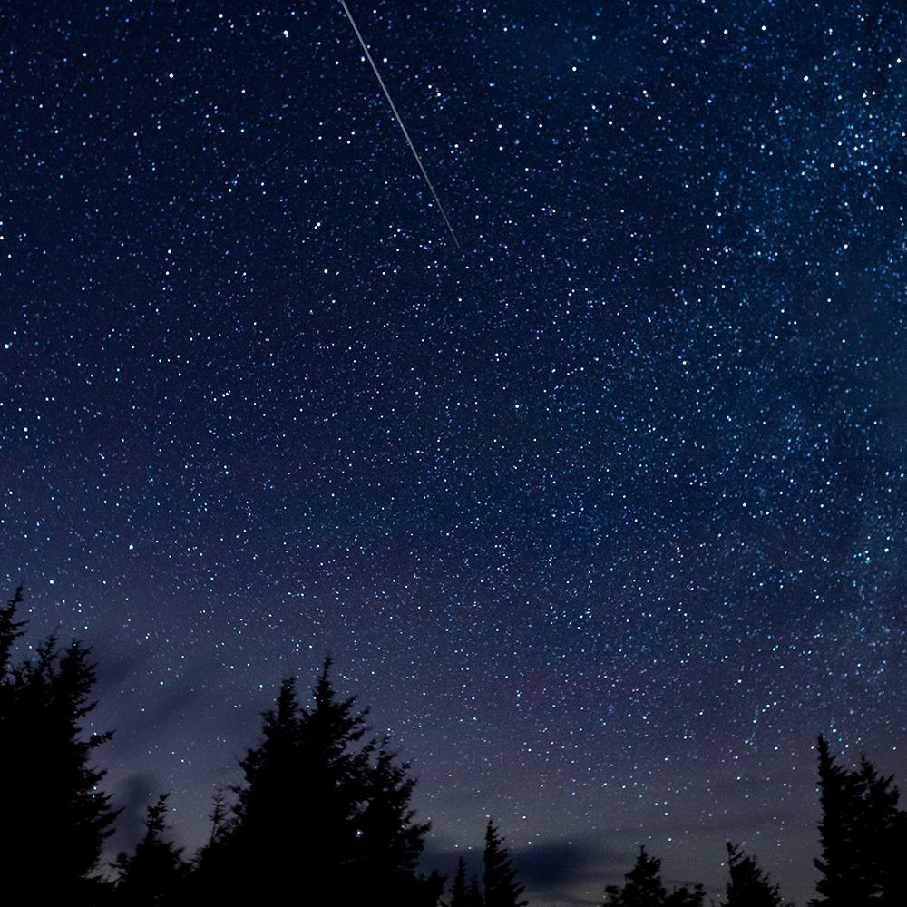 In this 30 second exposure, a meteor streaks across the sky during the annual Perseid meteor shower Thursday, Aug. 13, 2015, in Spruce Knob, West Virginia.