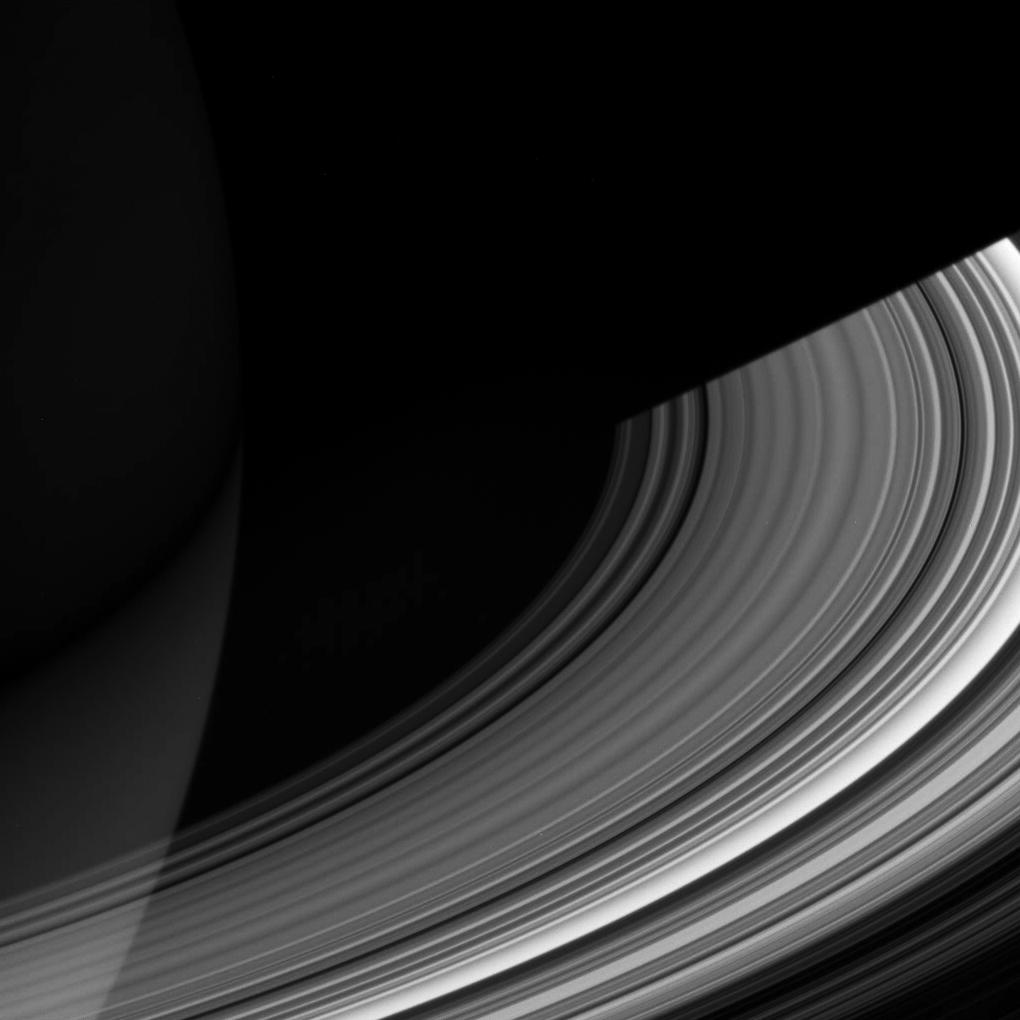 The C ring sweeps out of the darkness of Saturn's shadow