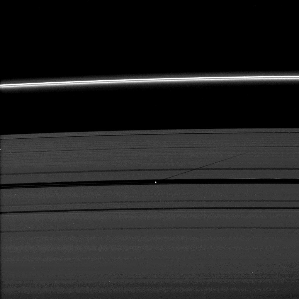 The moon Pan casts a shadow on Saturn's outer A ring in this image taken as the planet approached its August 2009 equinox.