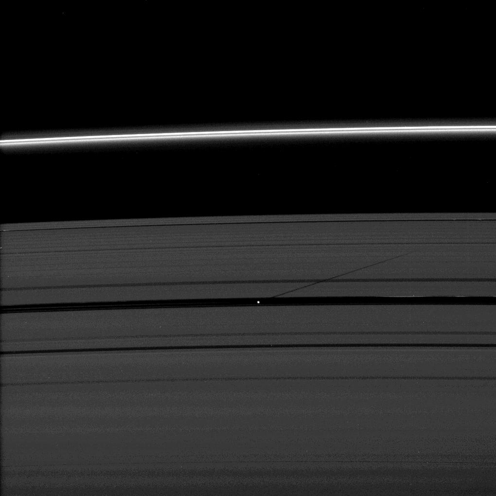 The moon Pan casts a shadow on Saturn's outer A ring in this image taken as the planet approached its August 2009 equinox.