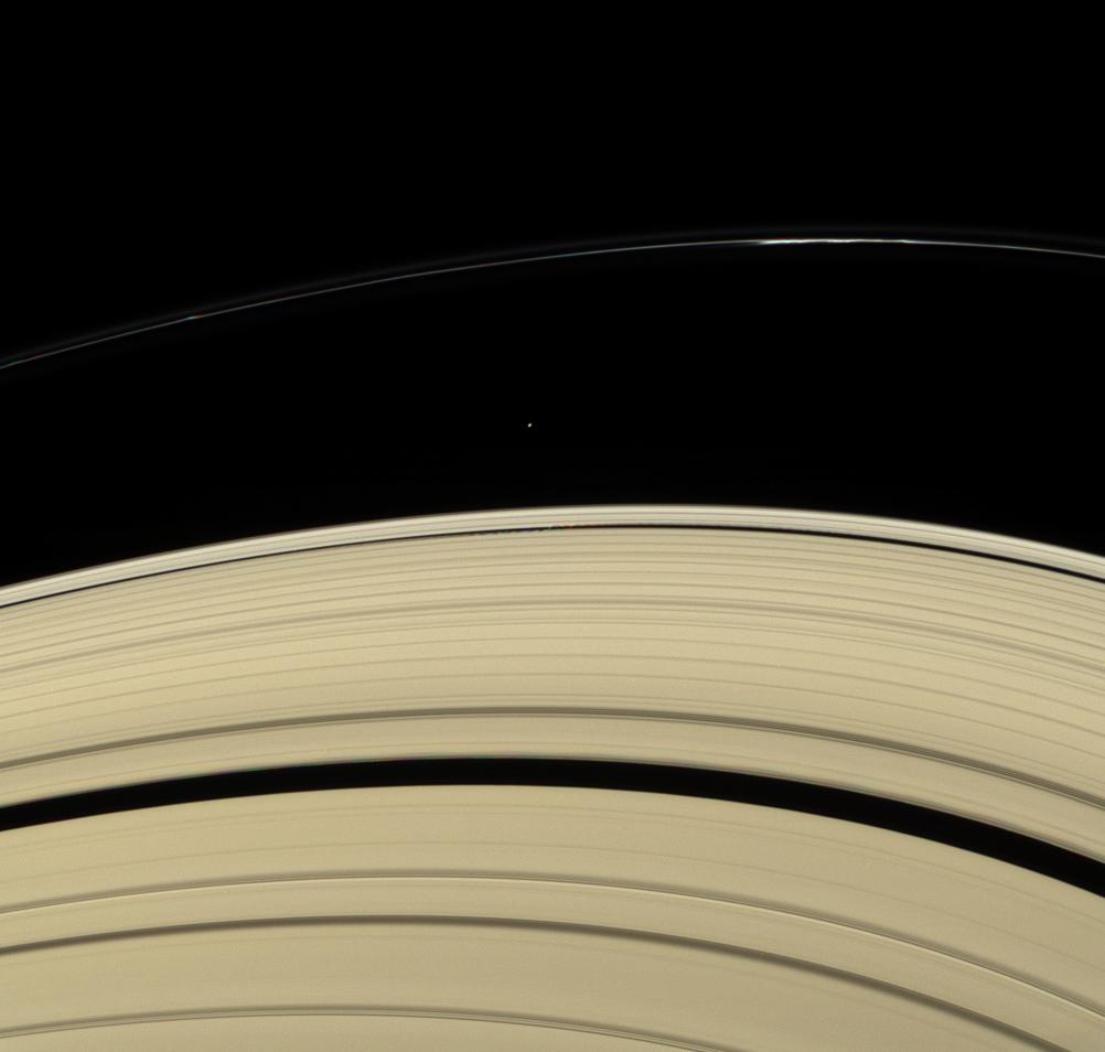 Saturn's rings and two small moons: Atlas and Daphnis