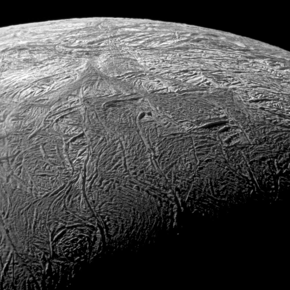 This wide-angle image shows the south polar region of Saturn’s moon Enceladus and outlines the area covered by the high-resolution mosaic combining data from the imaging science subsystem and composite infrared spectrometer aboard NASA’s Cassini spacecraft