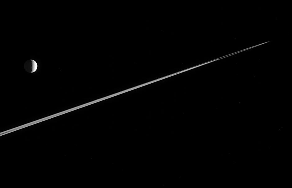 Saturn's moon Tethys near the rings