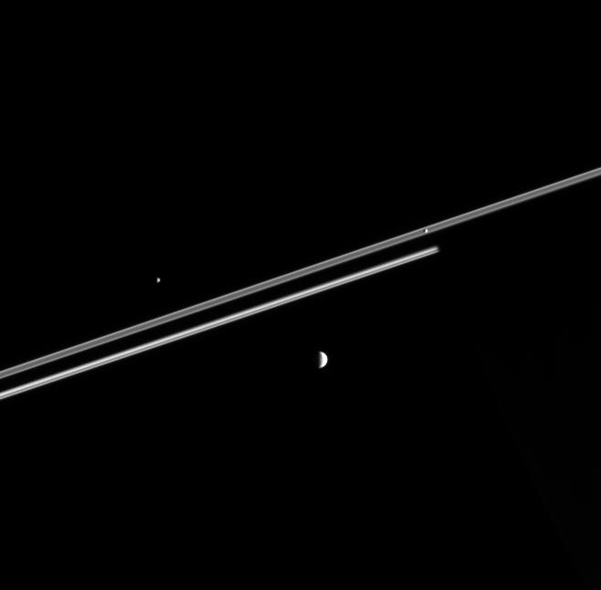 Dark Saturn, its rings, and the moons Epimetheus, Mimas and Pandora
