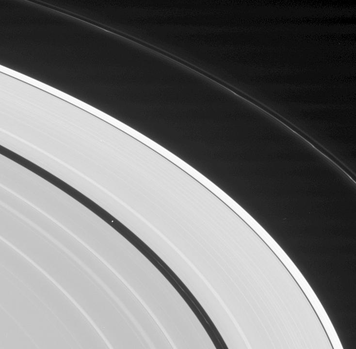 Saturn's rings and the moon Pan