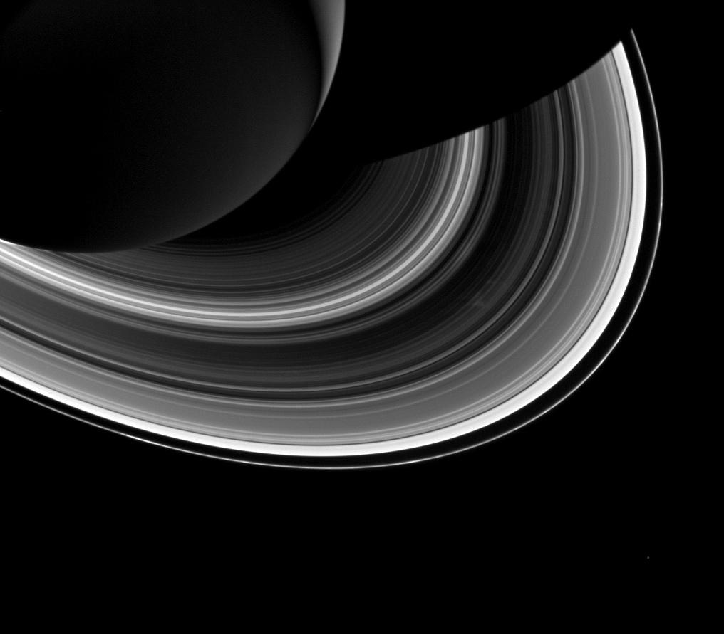 Saturn and its rings and the moon Mimas