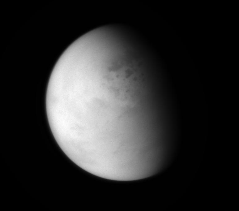 The Cassini spacecraft peers down though layers of haze to glimpse the lakes of Titan's northern regions.