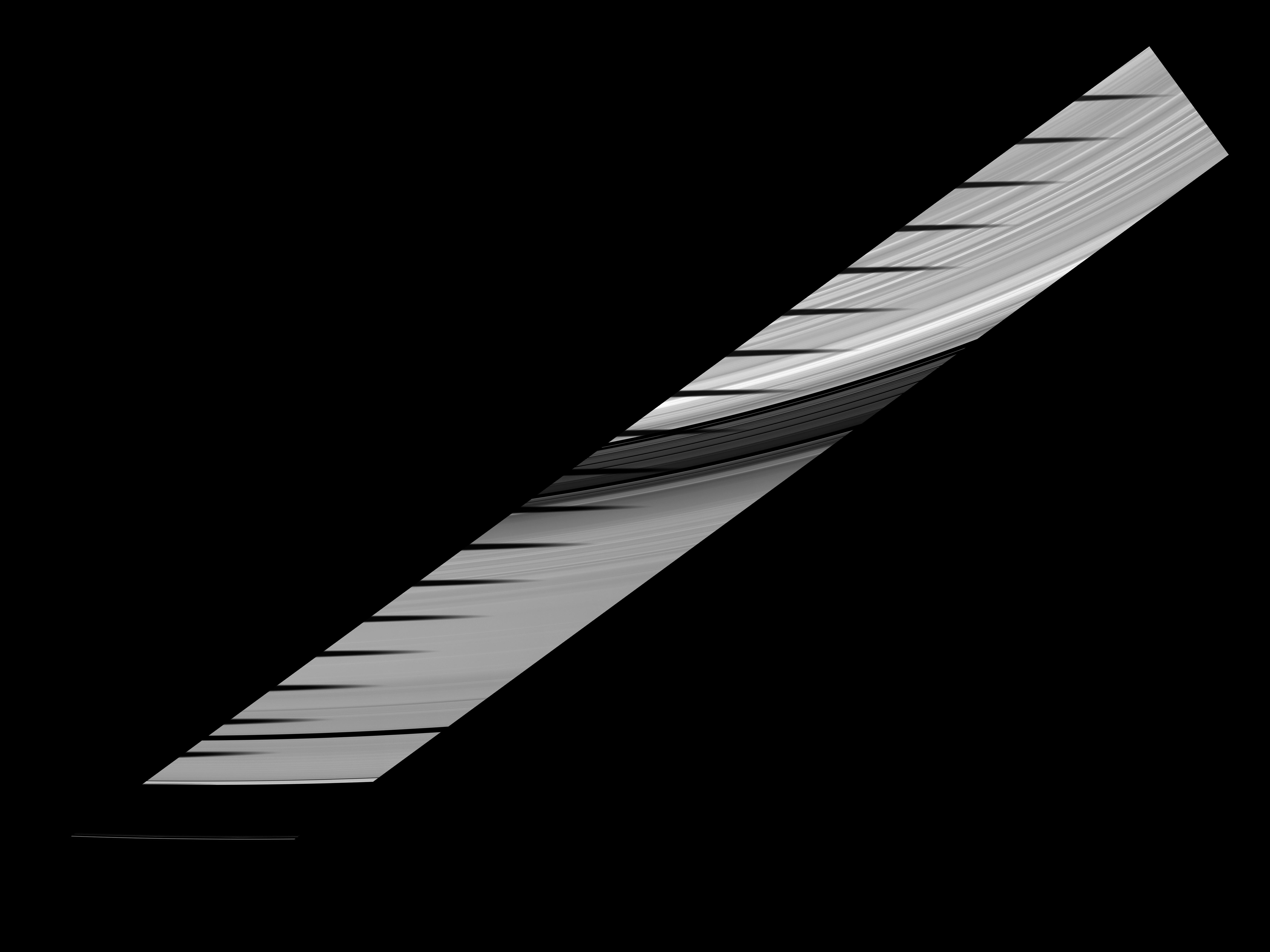 Mimas' shadow traverses the sunlit side of Saturn's rings in this movie and mosaic