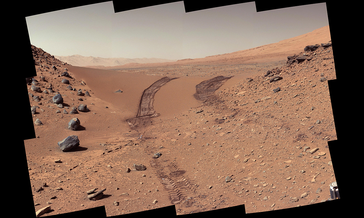 This look back at a dune that NASA's Curiosity Mars rover drove across was taken by the rover's Mast Camera (Mastcam) during the 538th Martian day, or sol, of Curiosity's work on Mars (Feb. 9, 2014).