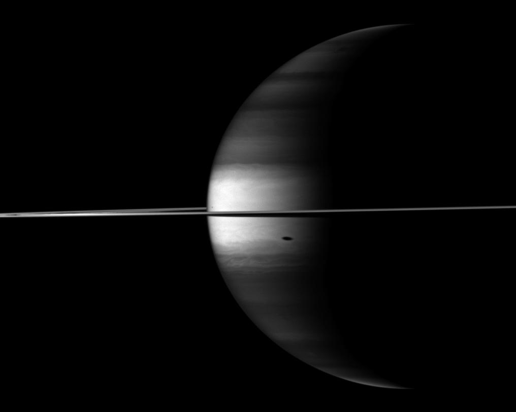 Saturn, its rings and the shadow of a couple of moons in near-infrared light