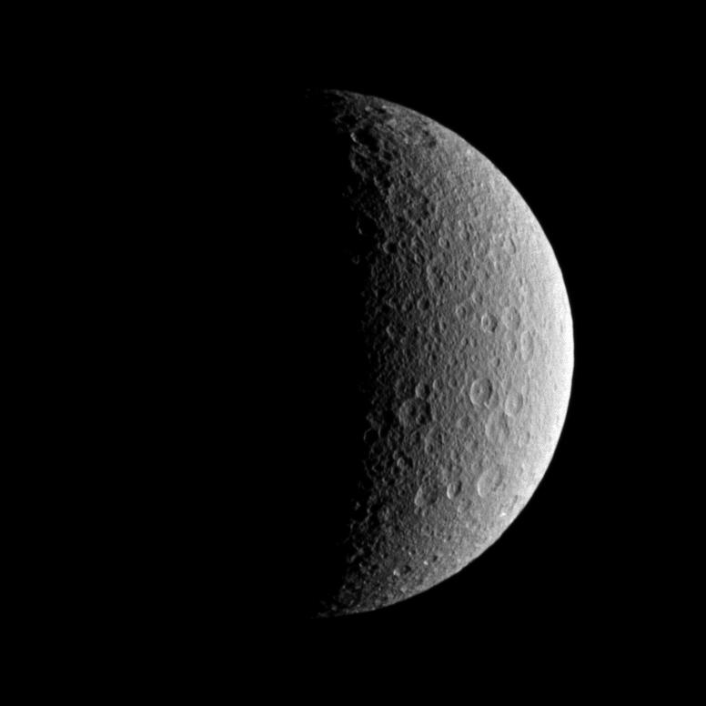 The battered surface of the moon Rhea.