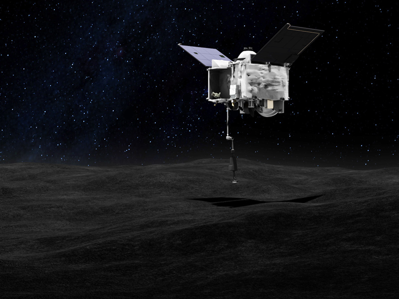 This artist’s concept shows the OSIRIS-REx spacecraft collecting a sample from Bennu
