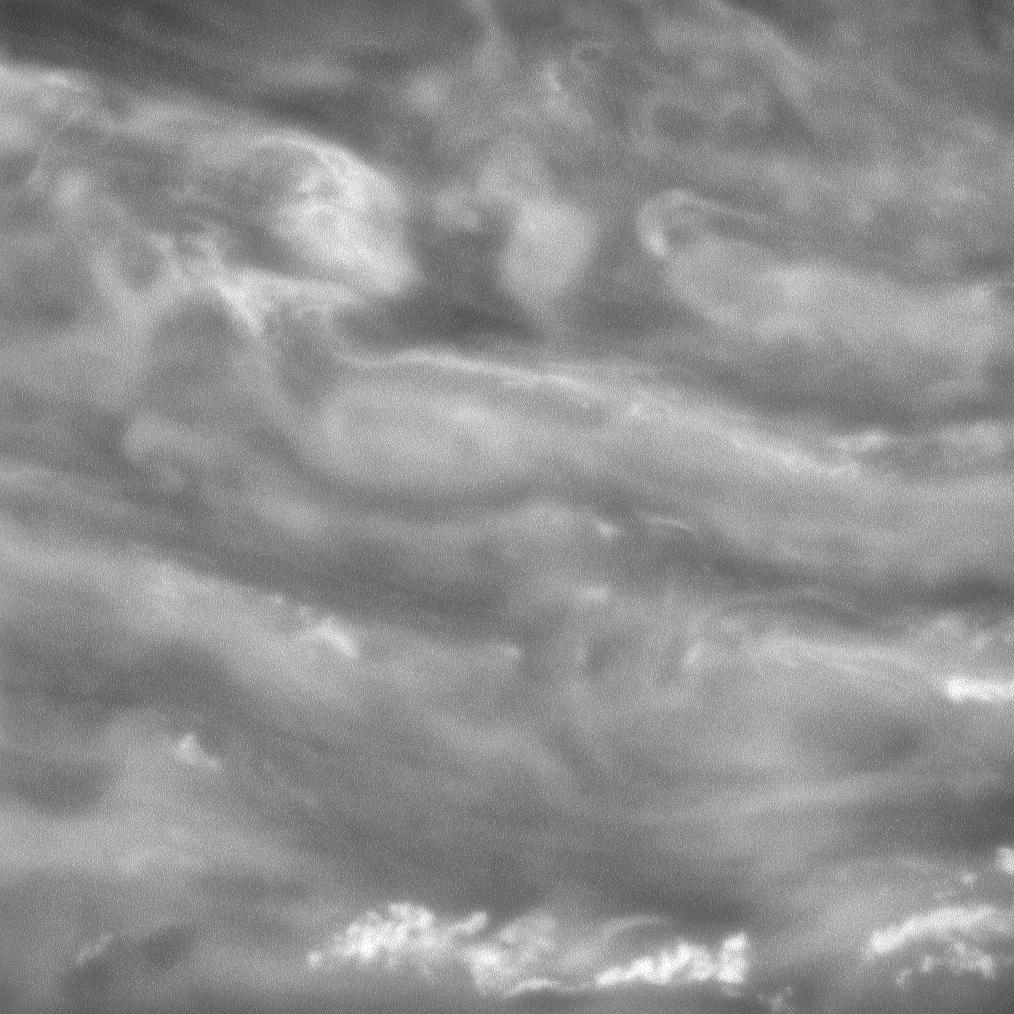 Swirling clouds in Saturn's murky depths