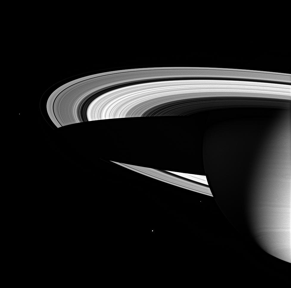 Three of Saturn's icy moons are seen here