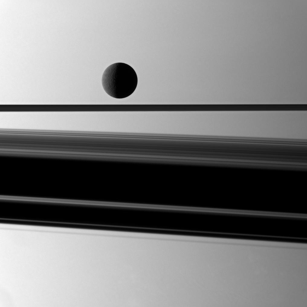 Rhea in front of Saturn