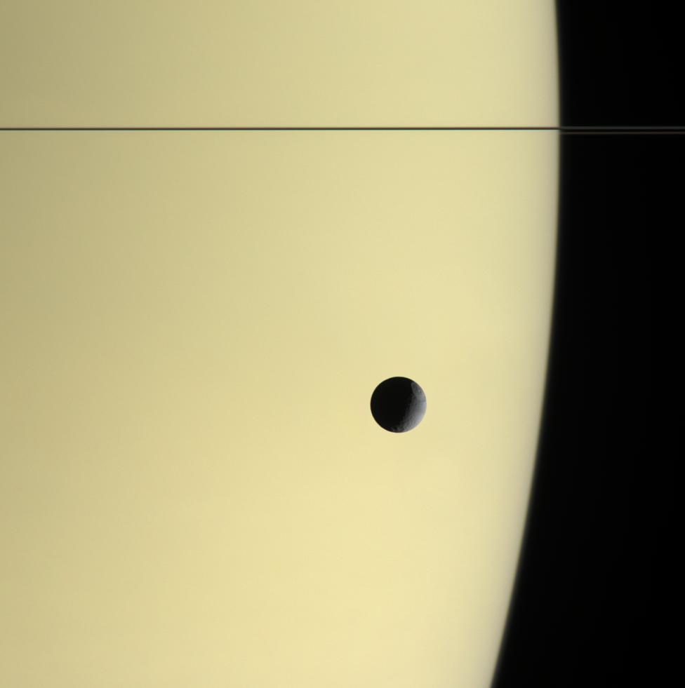 Tethys in front of Saturn
