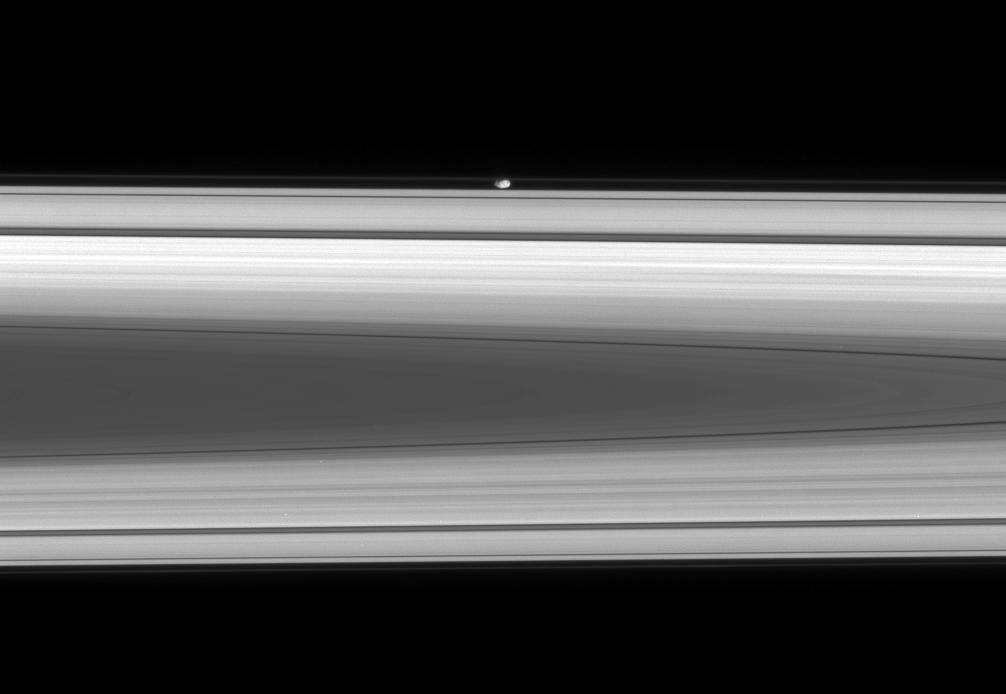 The flattened, potato-like form of Prometheus glides silently within the Roche Division, between Saturn's A and F rings.