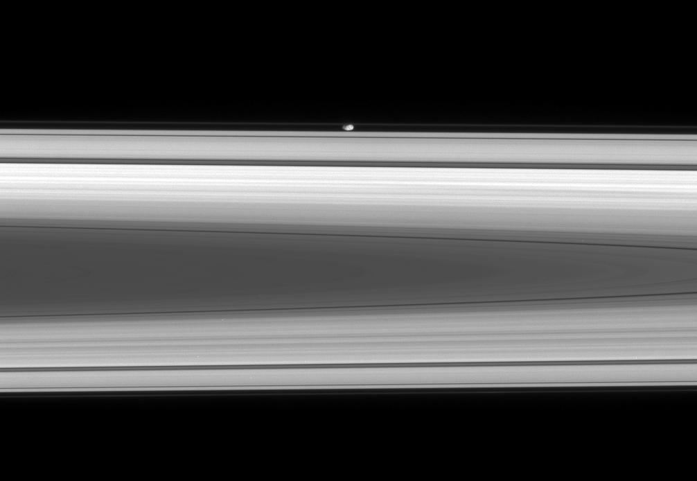 The flattened, potato-like form of Prometheus glides silently within the Roche Division, between Saturn's A and F rings.