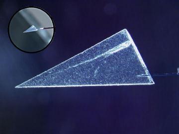 wedge-shaped slice of aerogel called a keystone with comet particle and track