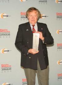Tom Duxbury holding the Popular Mechanics' Breakthrough Award for Innovation. Image courtesy of Popular Mechanics.