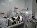 Photo of scientists inspecting the backup aerogel collector grid