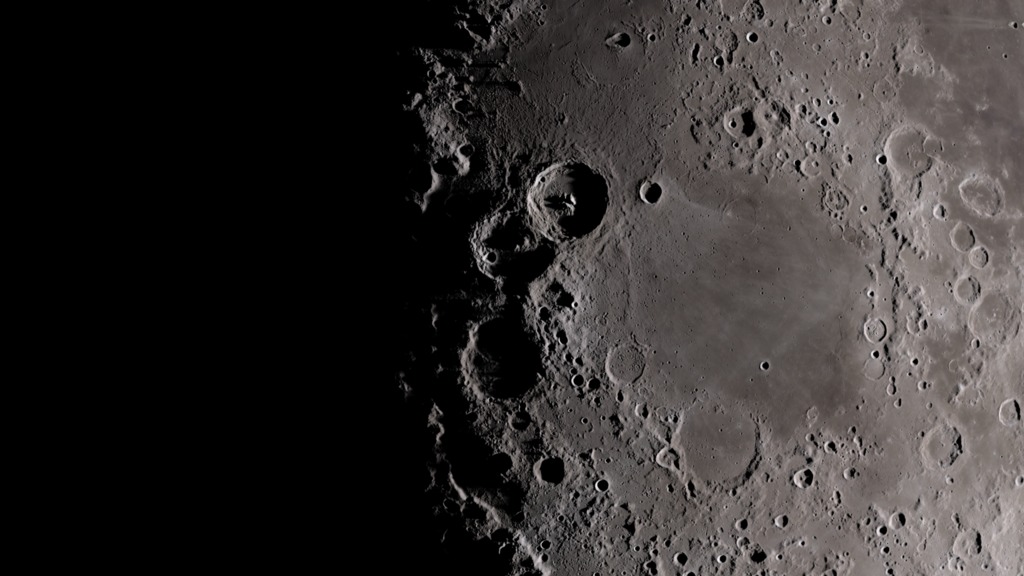 slide 5 - Image of the Moon with deep shadows