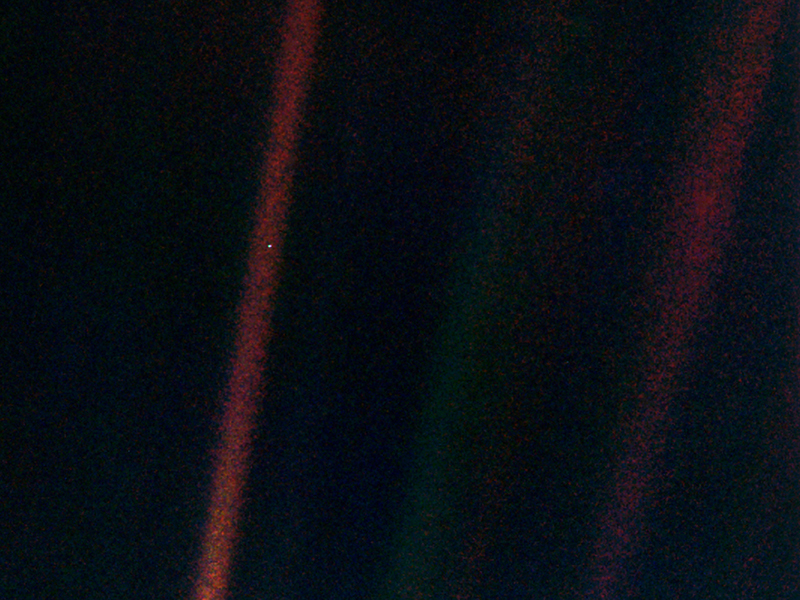 slide 1 - Earth as a small blue dot in the vastness of space.