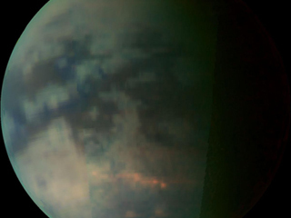 Clouds Over Titan: This image depicts Saturn's moon Titan as seen by the visual and infrared mapping spectrometer after closest approach on a July 22, 2006, flyby.
