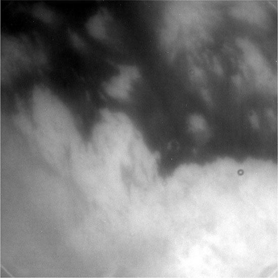 The Cassini spacecraft beamed back information and pictures tonight after successfully skimming the hazy atmosphere of Saturn's moon Titan. NASA's Deep Space Network tracking station in Madrid, Spain, acquired a signal at about 6:25 p.m. Pacific Daylight Time (9:25 p.m. Eastern Daylight Time). As anticipated, the spacecraft came within 1,200 kilometers (750 miles) of Titan's surface. (Source: Jet Propulsion Laboratory)