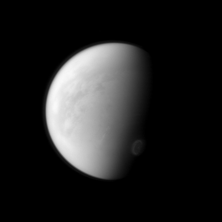 Titan's swirling south-polar vortex stands out brightly against the other clouds of the south pole (seen at the lower right of the image). The Cassini spacecraft is monitoring the development of the south polar vortex to help understand seasonal changes on Saturn's largest moon. The image was taken on Aug. 31 2012.
