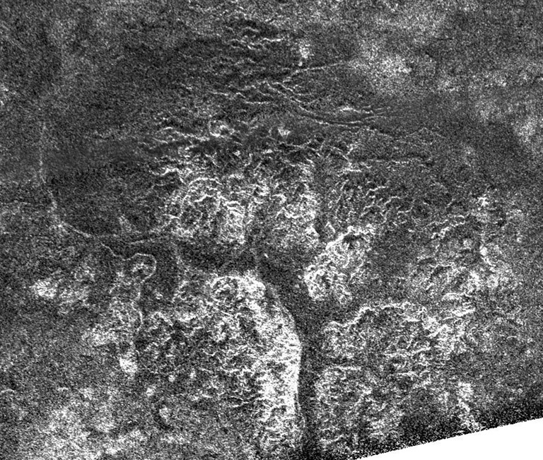 Complex and unique canyon systems appear to have been intricately carved into older terrain by the ample flow of liquid methane rivers on Saturn's moon Titan, as seen in this radar image taken on May 21, 2009.