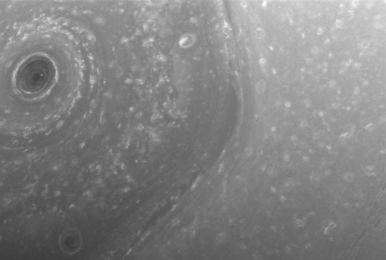 The view above shows part of the giant, hexagon-shaped jet stream around Saturn's north pole. Each side of the hexagon is about as wide as Earth. A circular storm lies at the center, at the pole. › Full caption . 