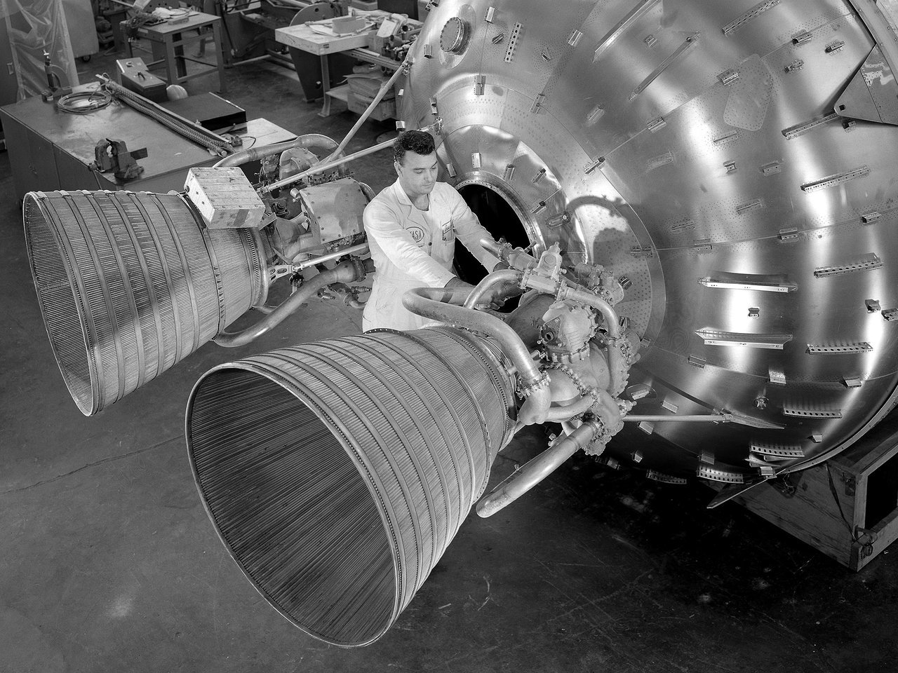 In this 1964 image a researcher prepares a Centaur 6A second-stage rocket for a series of tests in the Space Power Chamber's vacuum tank at NASA’s Lewis (now Glenn) Research Center. Credits: NASA