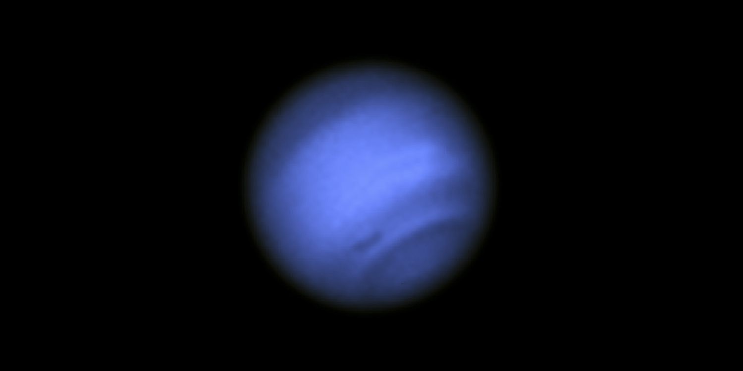 Neptune with giant spot on its side.