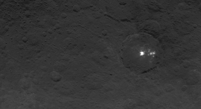 A cluster of mysterious bright spots on dwarf planet Ceres can be seen in this image