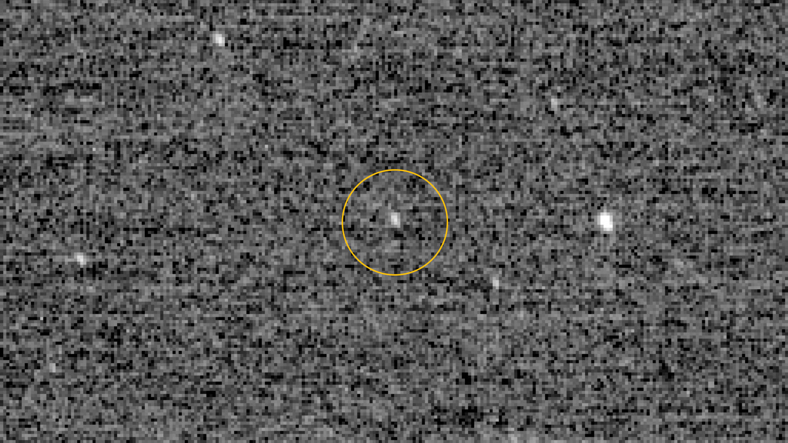 Fuzzy image of faint object in deep space.