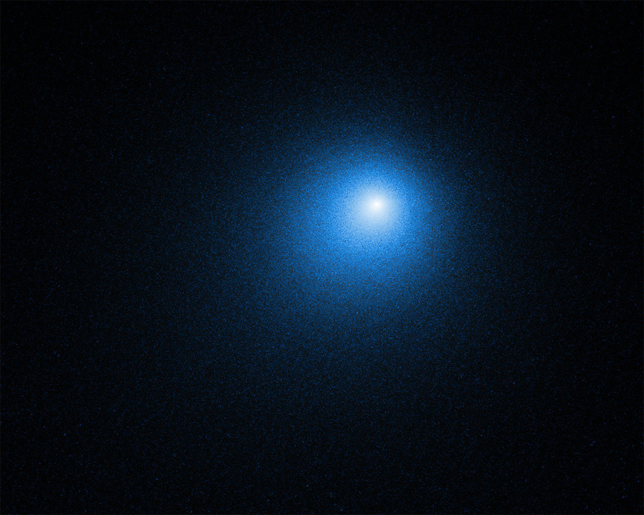 Bluish comet traveling through space.