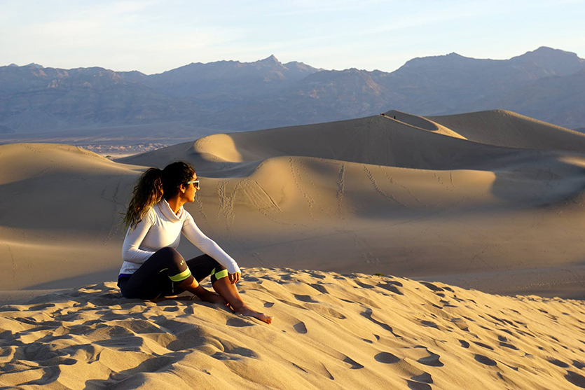 Farah Alibay sitting in the desert