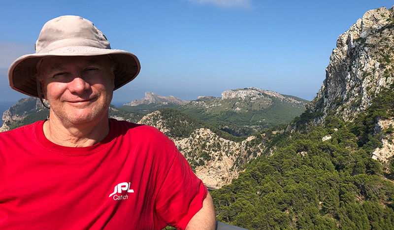 Image of Bruce Chapman in Spain with mountains behind him